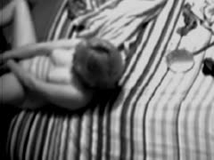 A naked lady uses a dildo to stuff her ass and pusys while masturbating on a covert camera.